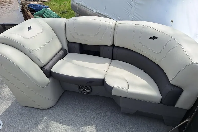 Slide: The Image of Luxurious seating on 2022 Starcraft SLS 1 DL boat, featuring plush, two-tone upholstery. - 11