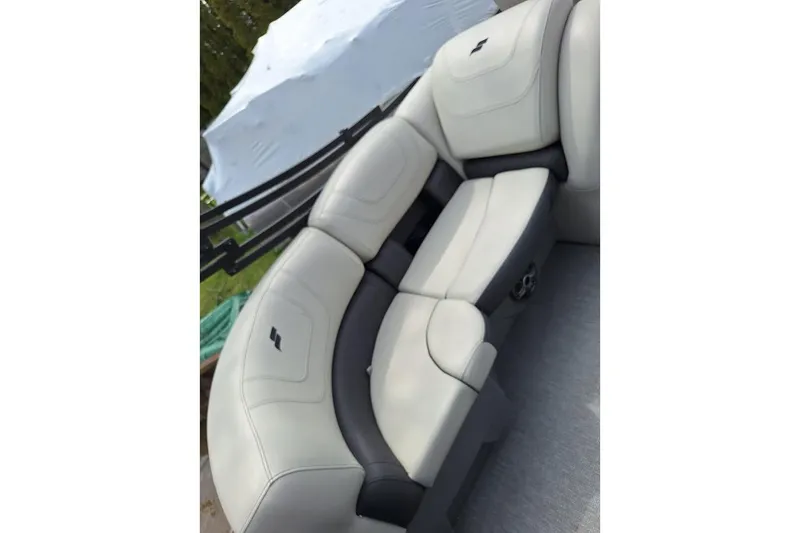 Slide: The Image of 2022 Starcraft SLS 1 DL boat interior with plush seating and modern design. - 13