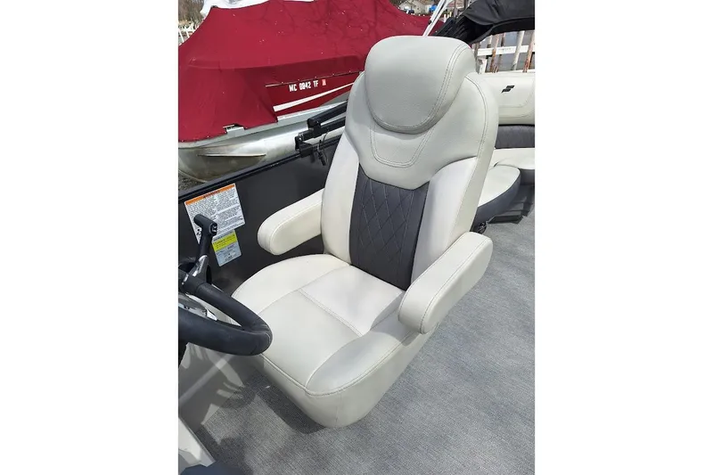 Slide: The Image of Captain's chair in a 2022 Starcraft SLS 1 DL boat, featuring plush upholstery and ergonomic design. - 6