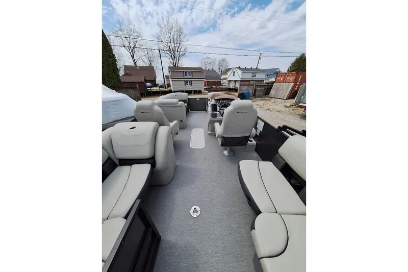 Slide: The Image of 2022 Starcraft SLS 1 DL pontoon boat interior with plush seating and modern design. - 9
