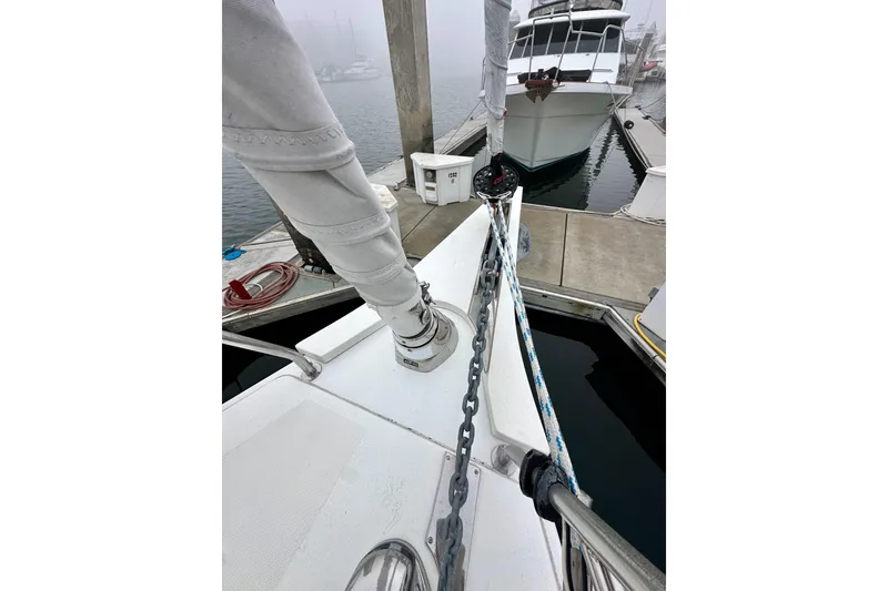 Slide: The Image of Bavaria C50 sailboat docked, showcasing deck and rigging details, 2020 model. - 22