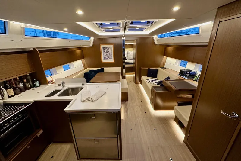 Slide: The Image of Luxurious interior of a 2020 Bavaria C50 yacht with modern kitchen and seating area. - 44