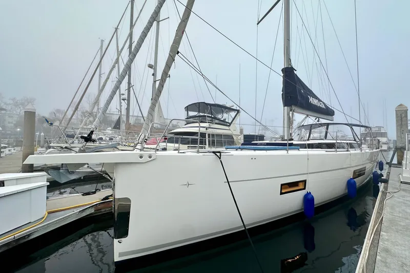 Slide: The Image of 2020 Bavaria C50 yacht docked at a marina on a foggy day. - 5