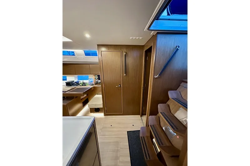 Slide: The Image of Interior of 2020 Bavaria C50 yacht with modern wood finish and sleek design. - 55