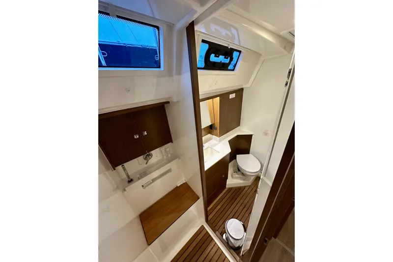 Slide: The Image of Modern bathroom interior of 2020 Bavaria C50 yacht with wooden accents and compact design. - 56