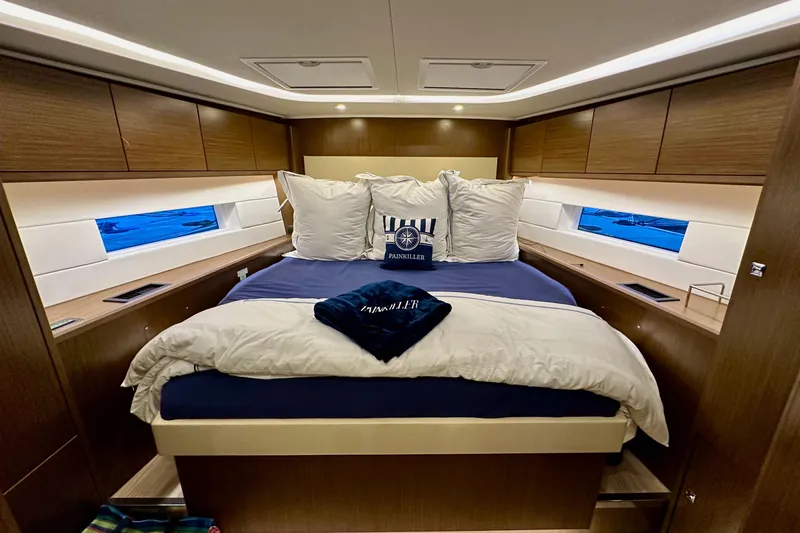 Slide: The Image of Luxurious cabin interior of 2020 Bavaria C50 yacht with cozy bedding and wooden finishes. - 70