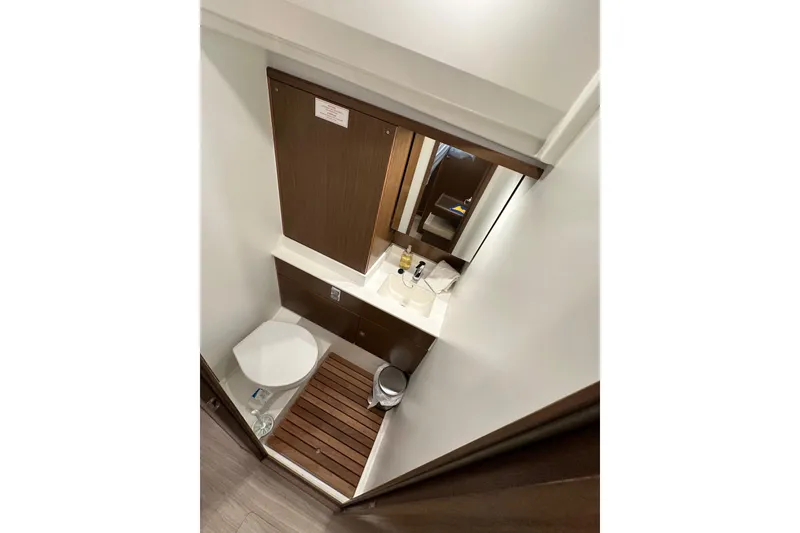Slide: The Image of Modern bathroom interior on 2020 Bavaria C50 yacht, featuring sleek design and wooden accents. - 74