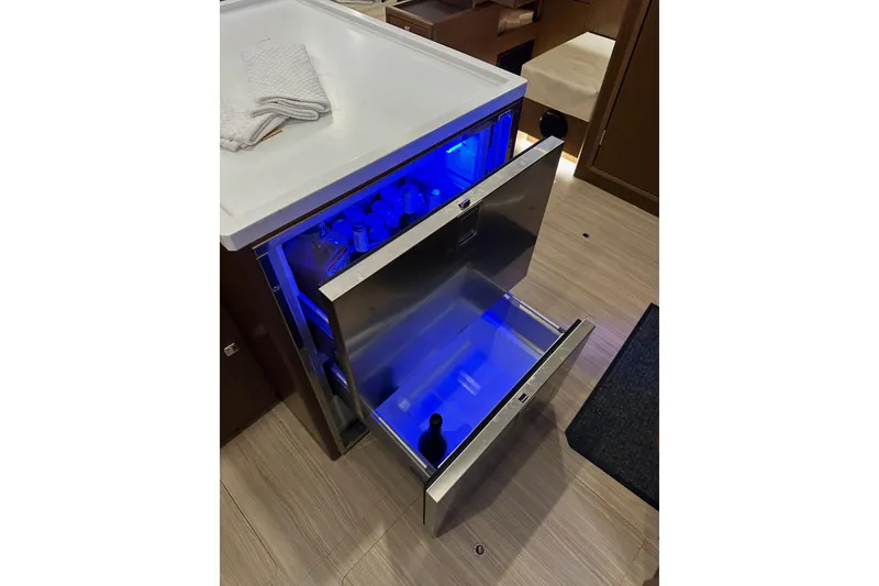 Slide: The Image of Open drawer fridge with blue lighting on Bavaria C50 yacht, 2020 model. - 87