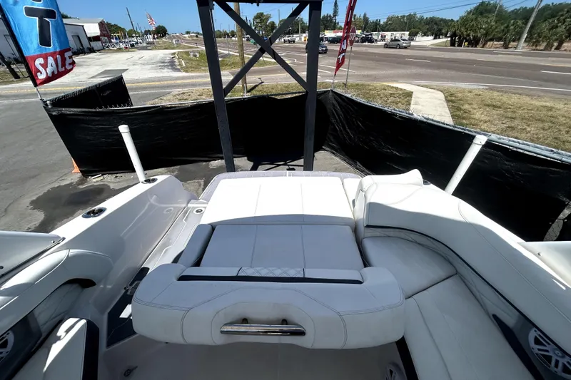 Slide: The Image of 2021 Regal 26 FasDeck boat interior with white seating, displayed for sale. - 19