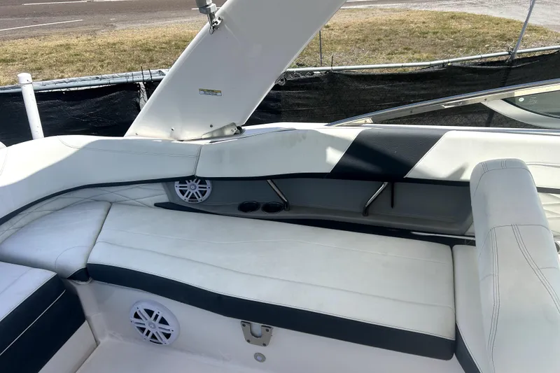 Slide: The Image of Interior seating of a 2021 Regal 26 FasDeck boat with white upholstery. - 20