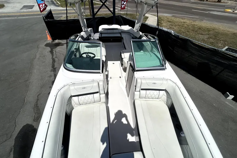 Slide: The Image of 2021 Regal 26 FasDeck boat with spacious seating and sleek design. - 27