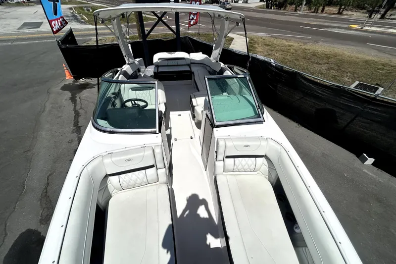 Slide: The Image of 2021 Regal 26 FasDeck boat with spacious seating and modern design. - 28