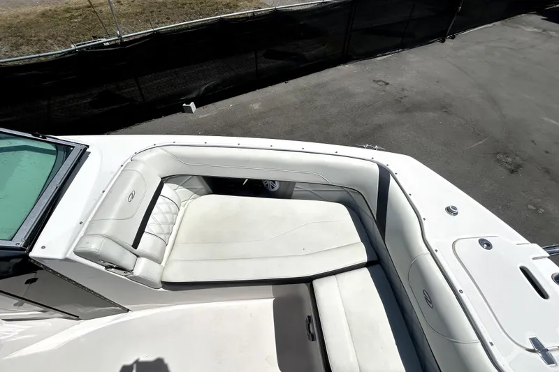 Slide: The Image of 2021 Regal 26 FasDeck boat interior with white seating and sleek design. - 32