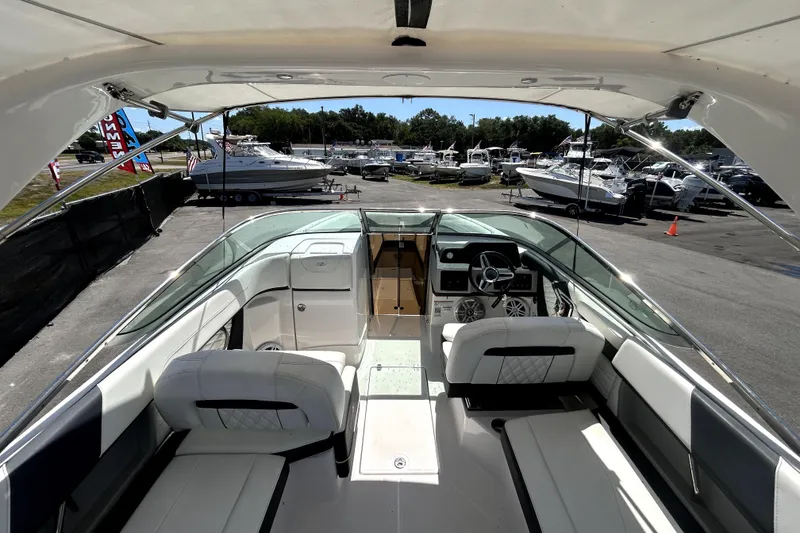 Slide: The Image of Interior view of a 2021 Regal 26 FasDeck boat at a marina. - 39