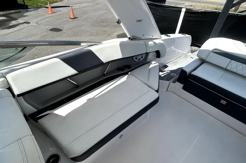 Slide: The Image of Interior of a 2021 Regal 26 FasDeck boat with white seating and modern design. - 49