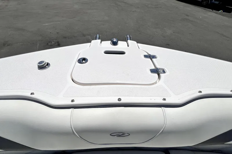 Slide: The Image of Bow of 2021 Regal 26 FasDeck boat with storage hatch and fittings. - 66
