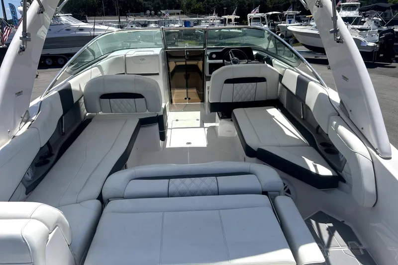 Slide: The Image of 2021 Regal 26 FasDeck boat interior with luxurious white seating and modern design. - 69