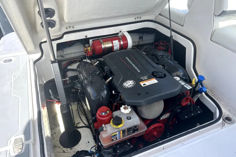 Slide: The Image of Engine compartment of a 2021 Regal 26 FasDeck boat, featuring a Volvo Penta engine. - 73