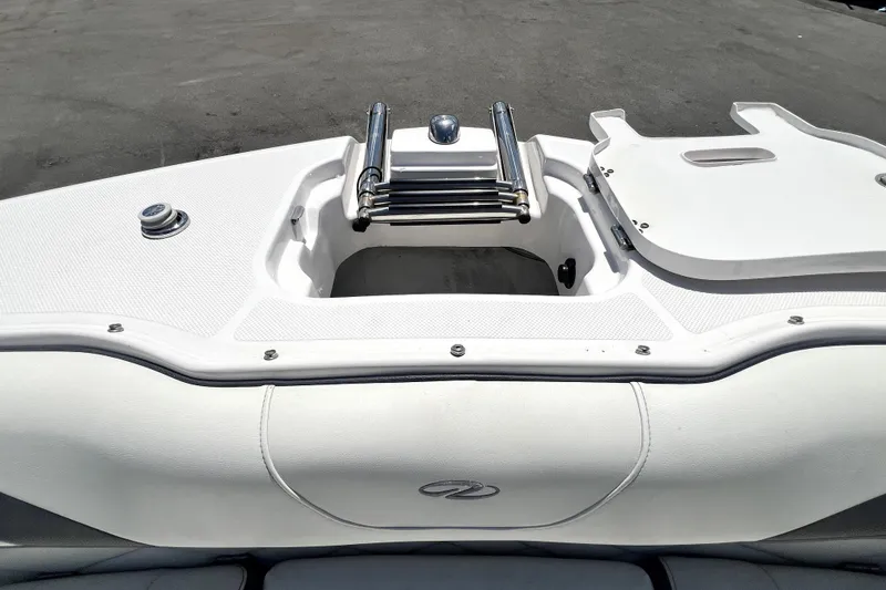 Slide: The Image of 2021 Regal 26 FasDeck boat stern with swim platform and ladder. - 76