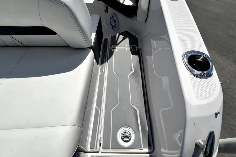 Slide: The Image of 2021 Regal 26 FasDeck boat interior with white seating and sleek deck design. - 77