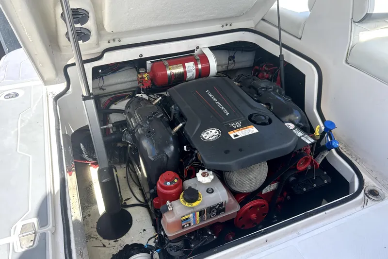 Slide: The Image of Engine compartment of a 2021 Regal 26 FasDeck boat, featuring a Volvo Penta engine. - 78