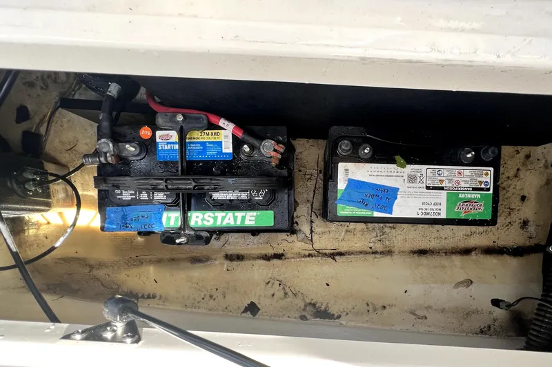 Slide: The Image of Battery compartment of a 2021 Regal 26 FasDeck boat with Interstate batteries. - 87