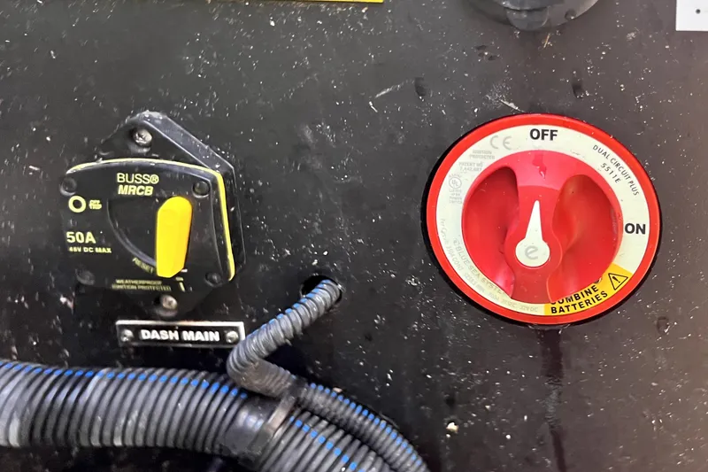 Slide: The Image of Control panel of a 2021 Regal 26 FasDeck boat with switches and wiring. - 89