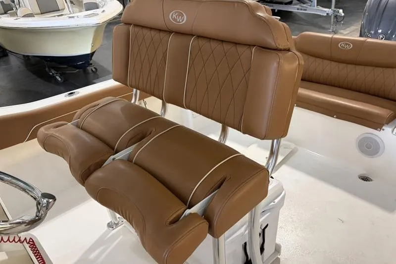 Slide: The Image of 2025 Key West 239 FS boat interior with brown leather seating and diamond stitching. - 14