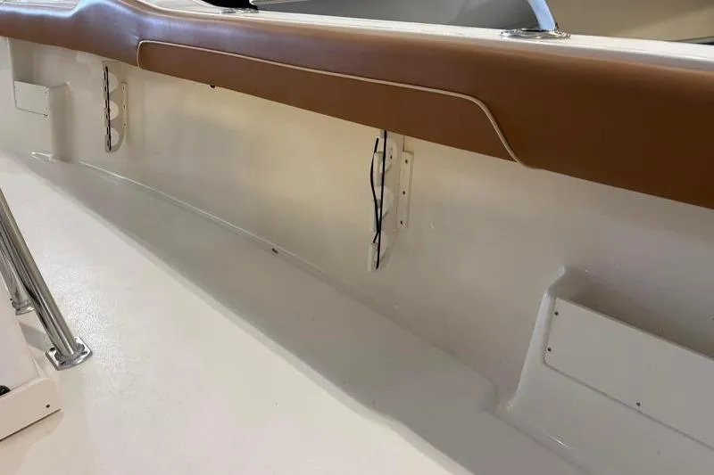 Slide: The Image of Interior view of 2025 Key West 239 FS boat, featuring sleek design and brown trim. - 20