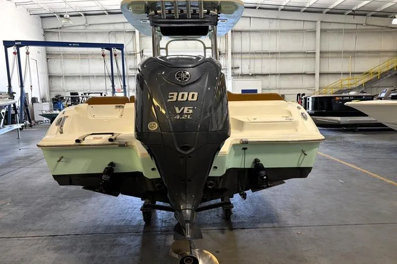 Slide: The Image of 2025 Key West 239 FS boat with Yamaha 300 V6 engine in a warehouse setting. - 3