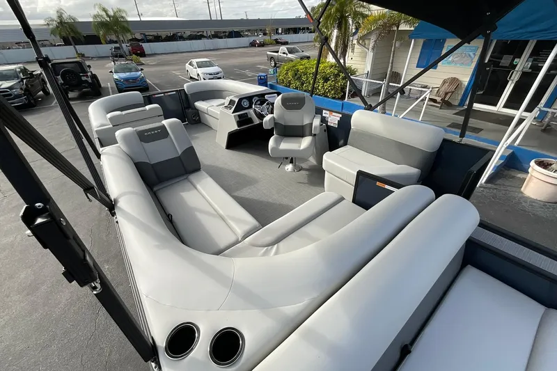 Slide: The Image of 2026 Crest Conquest SE 220 Cruise pontoon boat interior with spacious seating and modern design. - 19