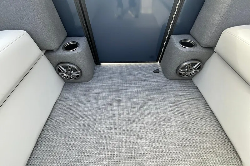 Slide: The Image of Interior of 2026 Crest Conquest SE 220 Cruise with speakers and cup holders. - 20