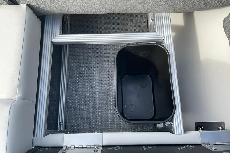 Slide: The Image of Interior view of 2026 Crest Conquest SE 220 Cruise with storage compartment. - 21