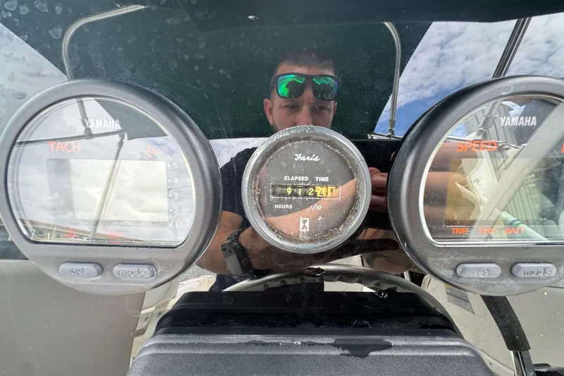 Slide: The Image of Close-up of 2000 Pursuit 2470 Walkaround boat dashboard with Yamaha gauges. - 13