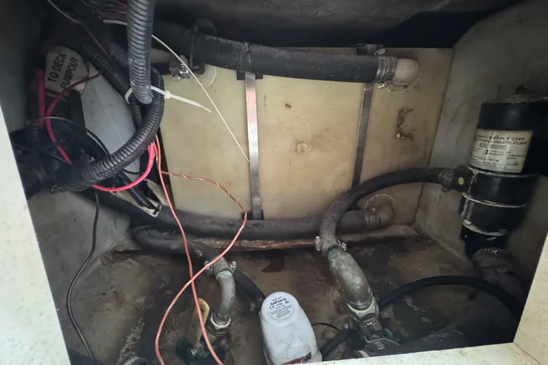 Slide: The Image of Interior view of a Pursuit 2470 Walkaround 2000 boat engine. - 30