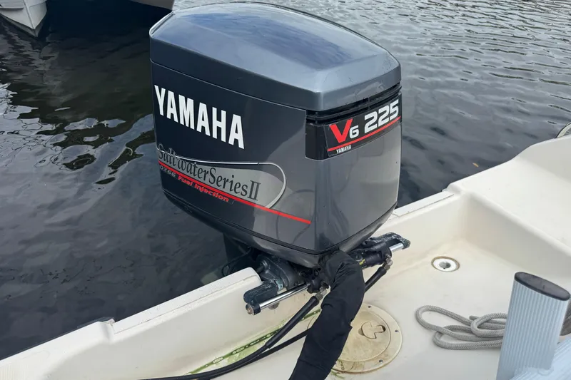 Slide: The Image of Yamaha V6 225 outboard motor on a 2000 Pursuit 2470 Walkaround boat. - 35