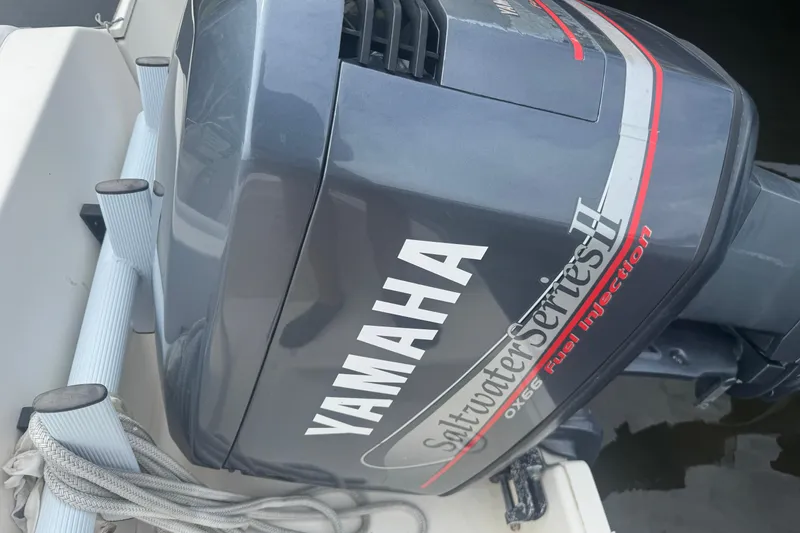 Slide: The Image of Yamaha Saltwater Series II outboard motor on 2000 Pursuit 2470 Walkaround boat. - 36