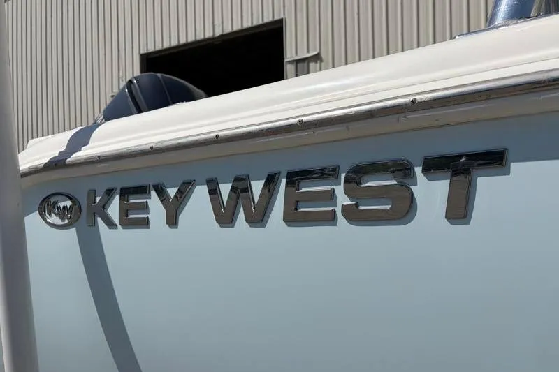 Slide: The Image of 2023 Key West 239 DFS boat side view with logo in sunlight. - 14