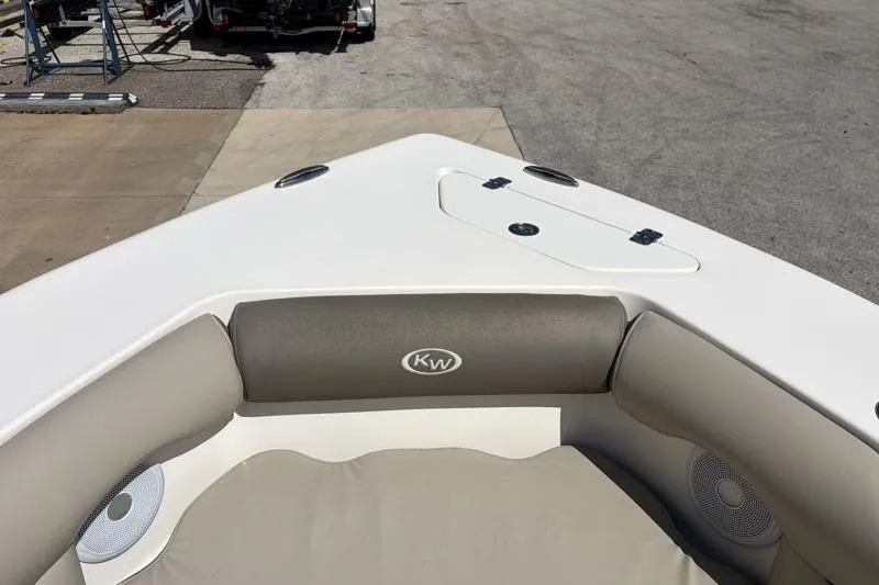Slide: The Image of 2023 Key West 239 DFS boat interior with cushioned seating and speaker system. - 16