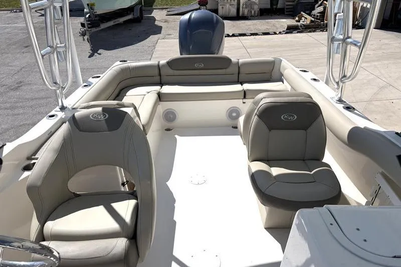 Slide: The Image of 2023 Key West 239 DFS boat interior with cushioned seating and modern design. - 17