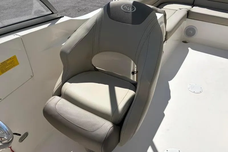 Slide: The Image of 2023 Key West 239 DFS boat seat, featuring gray and beige upholstery. - 18