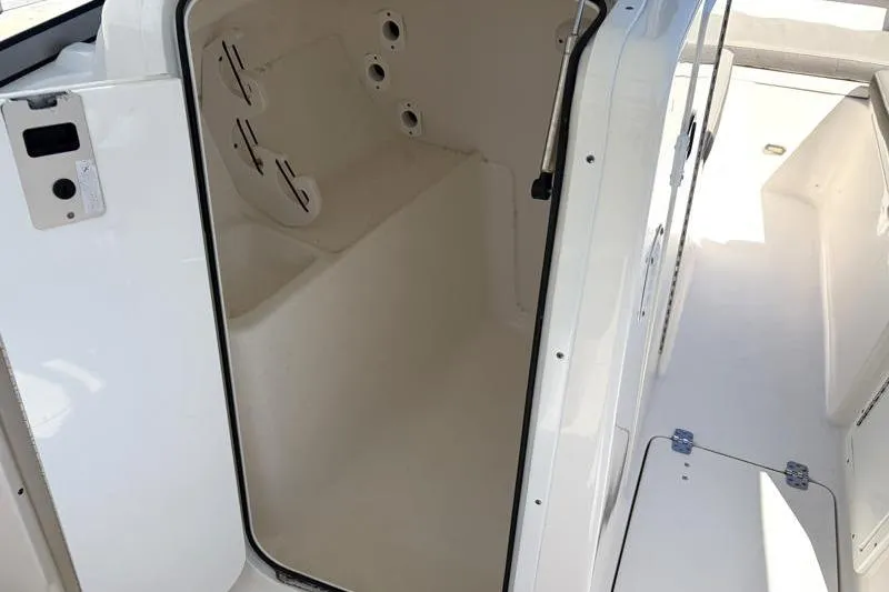 Slide: The Image of 2023 Key West 239 DFS boat interior, featuring a spacious storage compartment. - 25