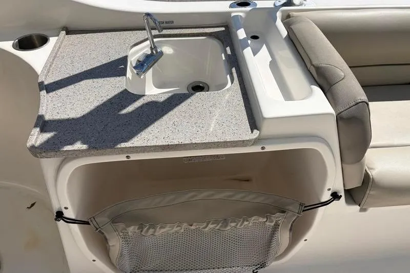 Slide: The Image of 2023 Key West 239 DFS boat sink and countertop with storage compartment. - 28