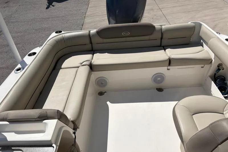 Slide: The Image of 2023 Key West 239 DFS boat interior with beige seating and spacious layout. - 29