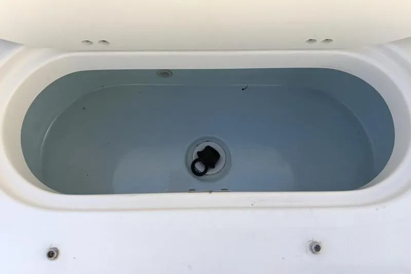 Slide: The Image of Livewell compartment of a 2023 Key West 239 DFS boat, featuring a clean interior. - 33
