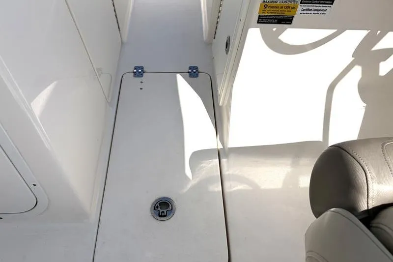 Slide: The Image of Interior view of 2023 Key West 239 DFS boat, featuring seating and storage area. - 34