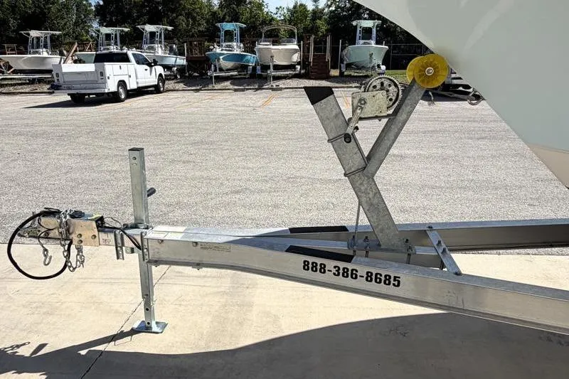 Slide: The Image of Boat trailer with Key West 239 DFS, 2023 model, parked in a lot with other boats. - 35