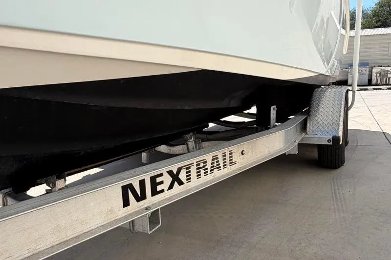 Slide: The Image of 2023 Key West 239 DFS boat on Nextrail trailer, parked outdoors. - 36