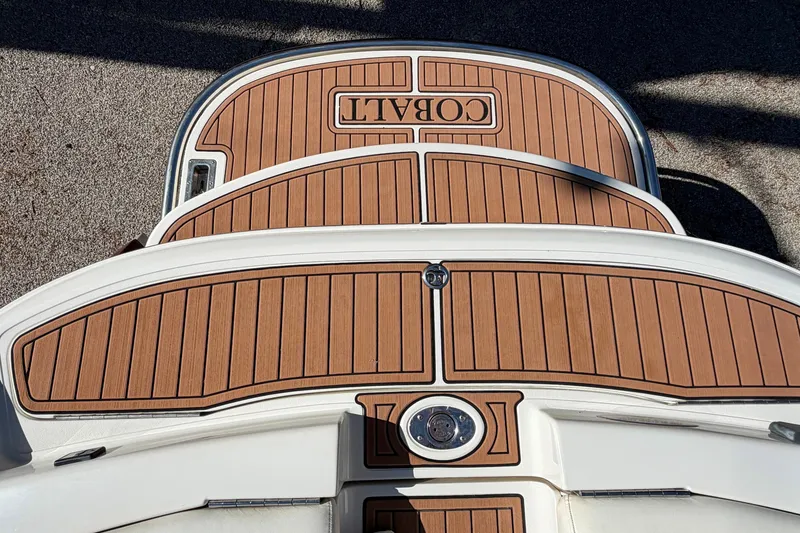 Slide: The Image of Rear deck of a 2004 Cobalt 250 boat with teak-style flooring. - 20