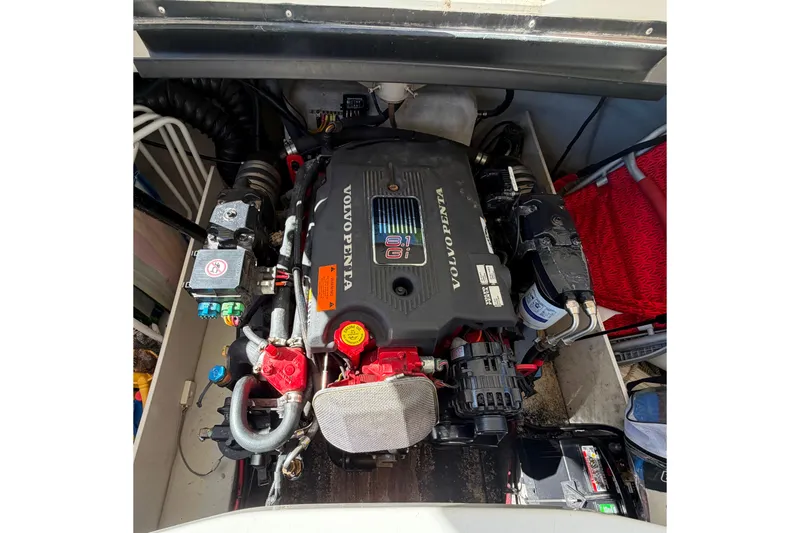 Slide: The Image of Volvo Penta engine in a 2004 Cobalt 250 boat, showcasing detailed components. - 26